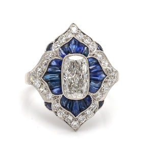 Platinum Cushion Cut Diamond Ring with Sapphire Accents