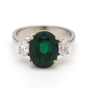 Platinum Ring with Oval Emerald and Diamond Accents